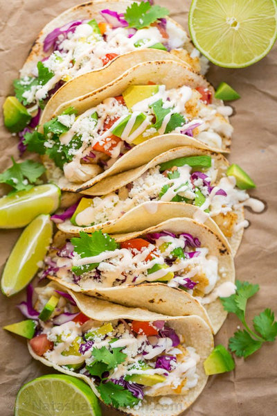 Wild caught Cod Fish Tacos with choice of tortilla served with Cabbage slaw and Avocado crema and Feta with Roasted Spring Asparagus