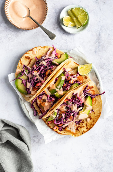 Salmon Tacos with Honey Lime Slaw and Avocado Lime drizzle (GF)