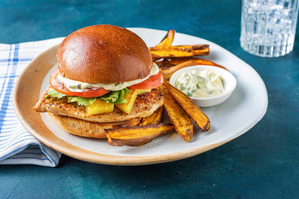 BBQ Ready Jerk Chicken Burger served with Pineapple salsa and Cabbage topping with Sweet Potato Wedges (low carb  version available)