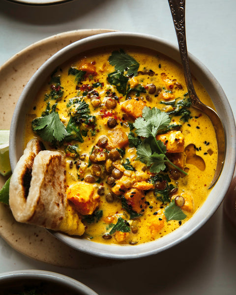 Ginger Sweet Potato Coconut Stew with Lentils and Kale with Naan for dipping