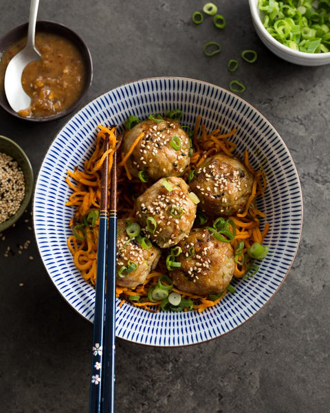 Whole 30 Orange Chicken Meatballs served with Roasted Asparagus