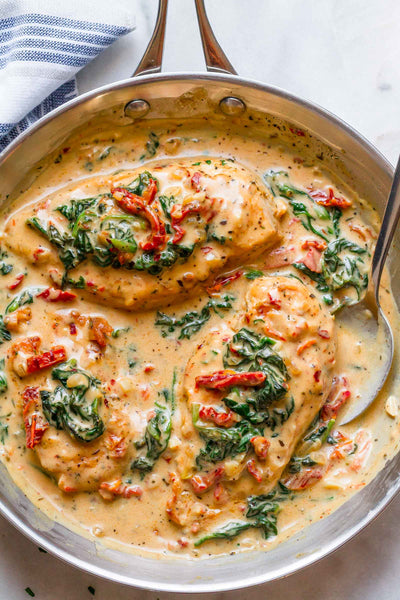 Chicken with Creamy Garlic Spinach Sauce served with choice of Side
