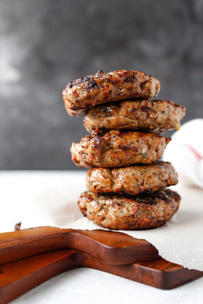 Whole 30 Sundried Tomato Chicken Burgers with Basil Aioli served with Roasted Asparagus